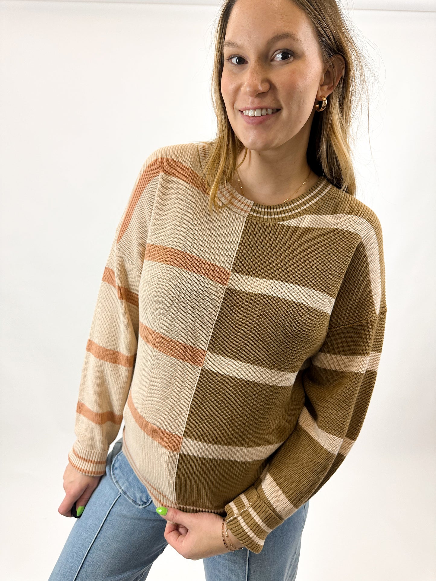 A women's striped top with warm shades of brown, perfect for every occasion.