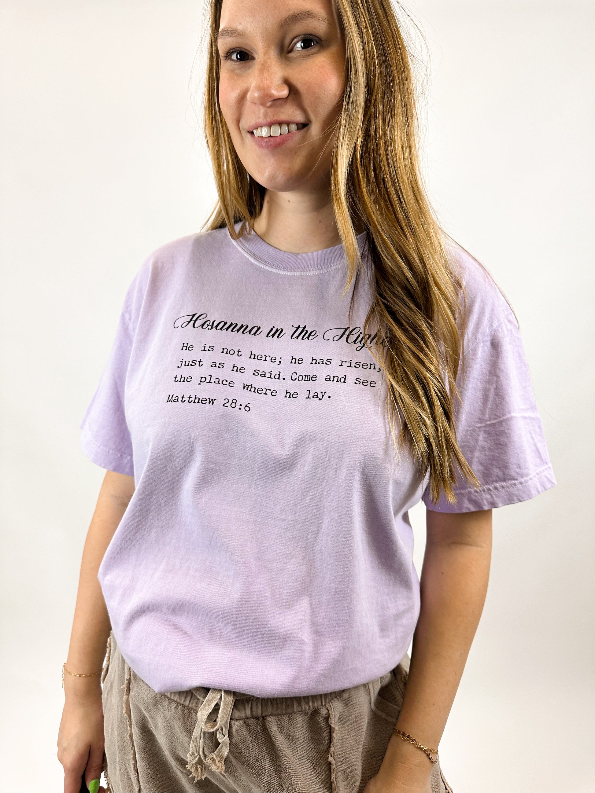 Spread the word, "Hosanna, he is risen" with this trendy light purple Easter tee.